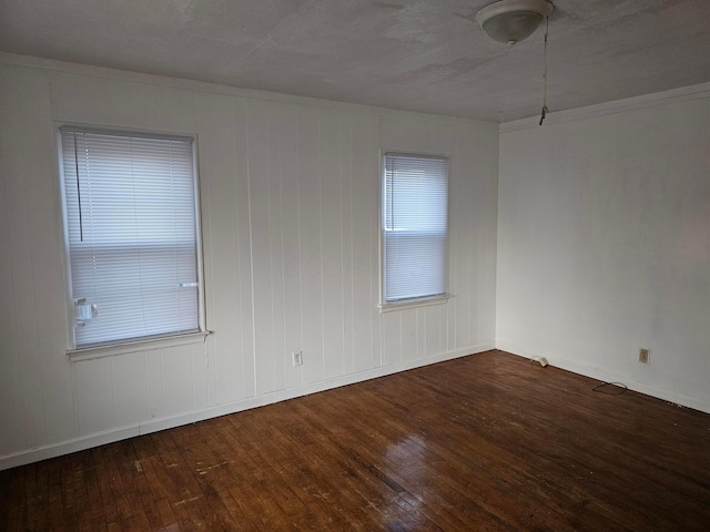 empty room featuring dark hardwood / wood-style flooring