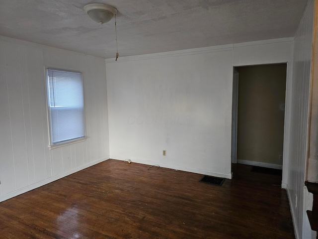 unfurnished room featuring dark hardwood / wood-style floors