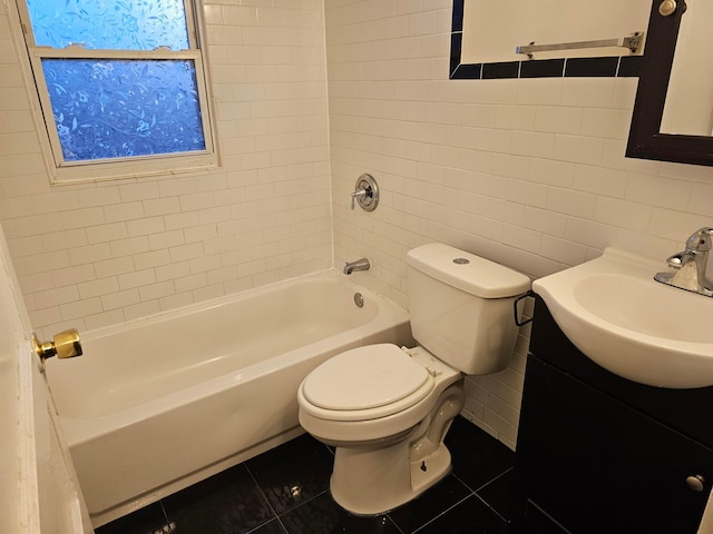 full bathroom with toilet, tile walls, vanity, tiled shower / bath combo, and tile patterned flooring