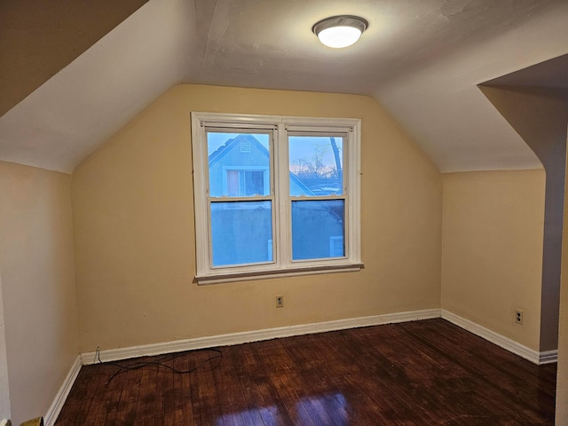 bonus room featuring hardwood / wood-style flooring and vaulted ceiling