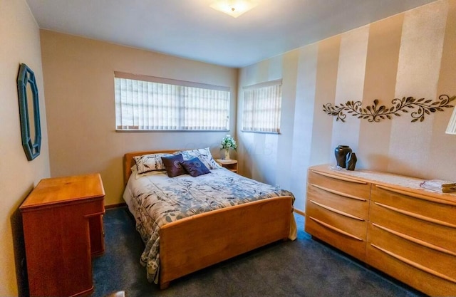 bedroom with dark carpet