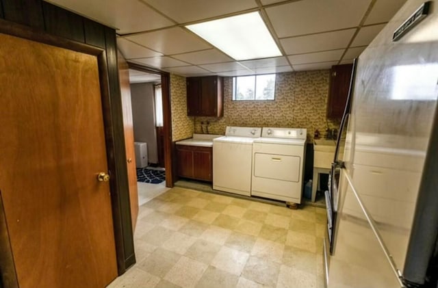 laundry room with cabinets and separate washer and dryer