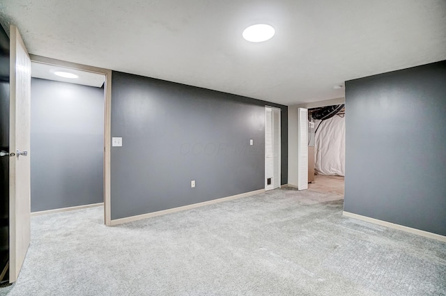 basement featuring light colored carpet