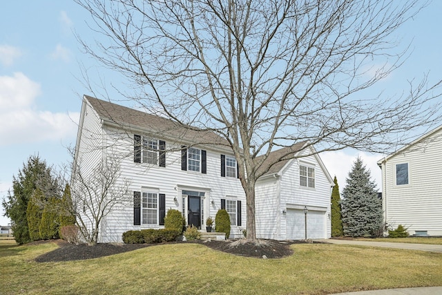 colonial home featuring an attached garage, roof with shingles, driveway, and a front lawn