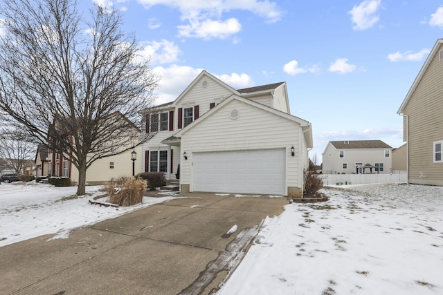 traditional home with driveway and an attached garage