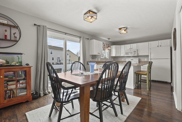 dining room featuring dark wood-style floors