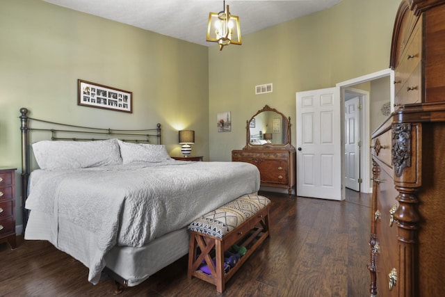 bedroom featuring high vaulted ceiling, visible vents, dark wood finished floors, and a notable chandelier