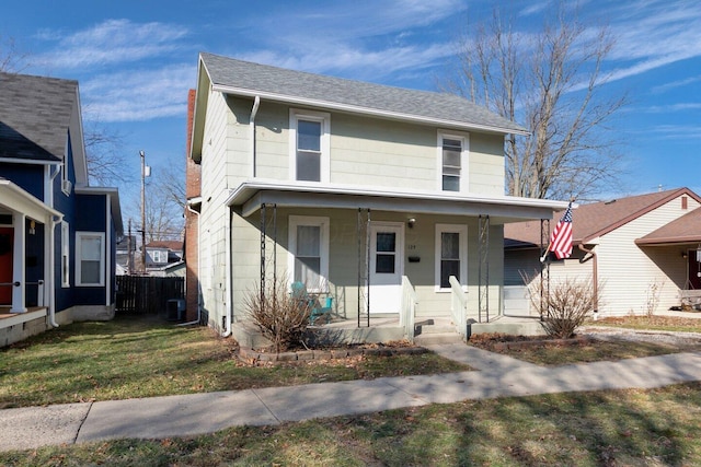 view of front facade featuring a front lawn and a porch