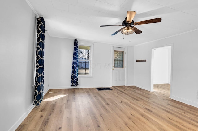 unfurnished room featuring crown molding, ceiling fan, and light hardwood / wood-style floors