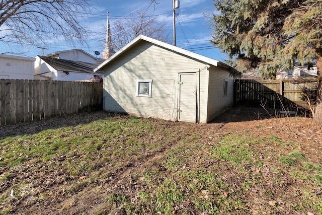 view of outbuilding featuring a lawn