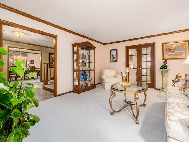 living area with a healthy amount of sunlight, stairway, crown molding, french doors, and carpet floors