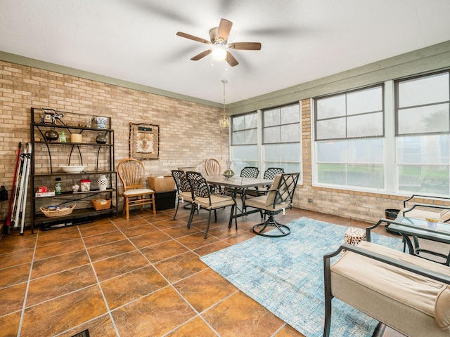 interior space with ceiling fan