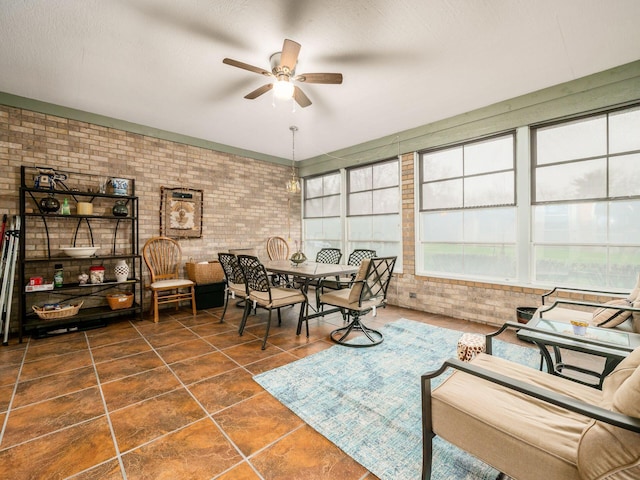 sunroom with a ceiling fan