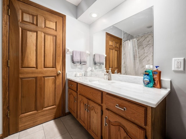 bathroom featuring a shower with shower curtain, vanity, and tile patterned floors