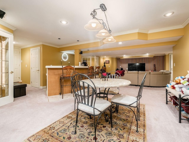 dining room featuring recessed lighting, ornamental molding, baseboards, and light colored carpet