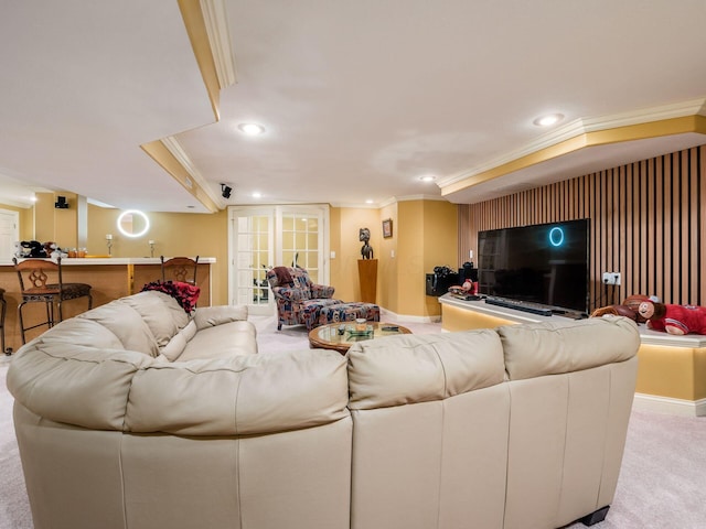 living room with recessed lighting, light colored carpet, crown molding, and baseboards