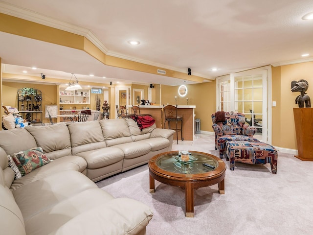 living area featuring a dry bar, light carpet, baseboards, and crown molding