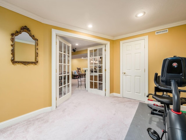 exercise area with baseboards, visible vents, carpet, crown molding, and french doors