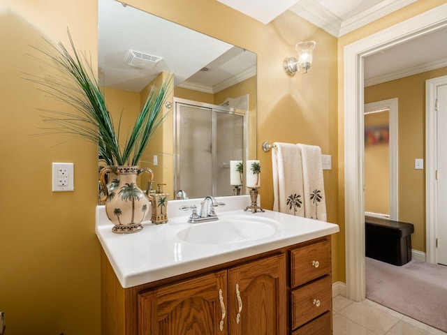 bathroom featuring visible vents, ornamental molding, vanity, a shower stall, and tile patterned floors