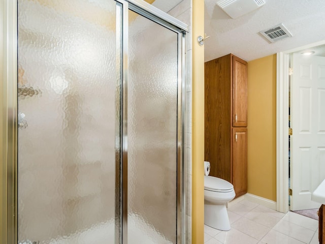 full bath featuring tile patterned flooring, visible vents, a shower stall, and toilet