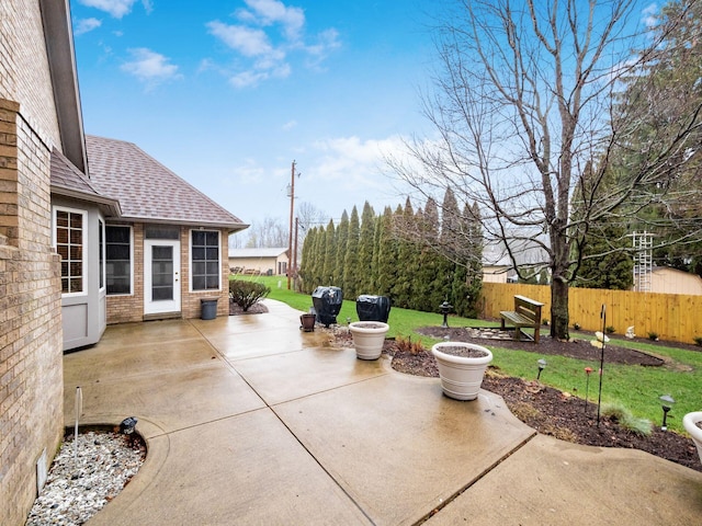 view of patio featuring fence