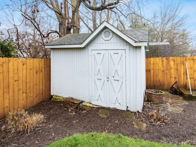 view of shed with a fenced backyard