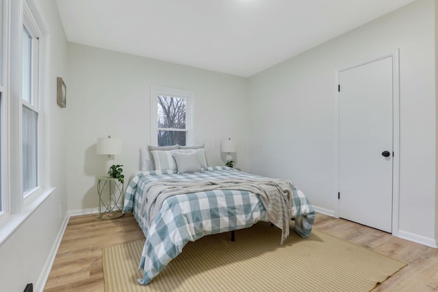 bedroom with light wood-type flooring