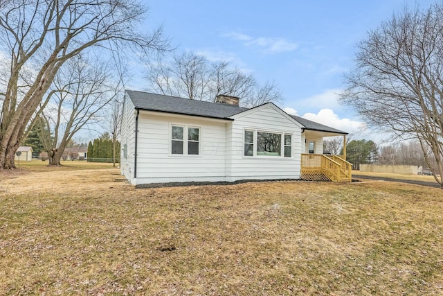 exterior space with covered porch and a lawn