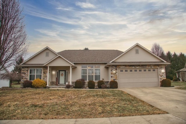 single story home with a garage and a lawn