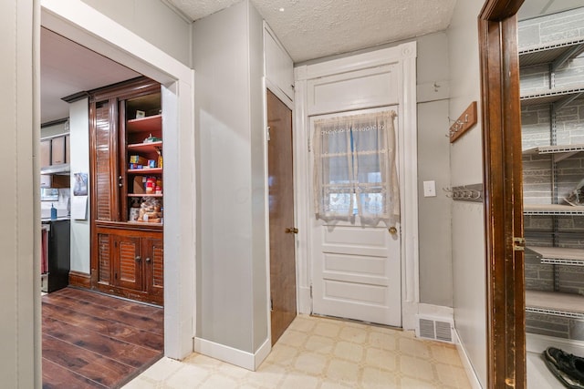 entrance foyer featuring a textured ceiling