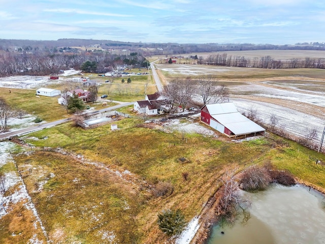 drone / aerial view with a water view and a rural view