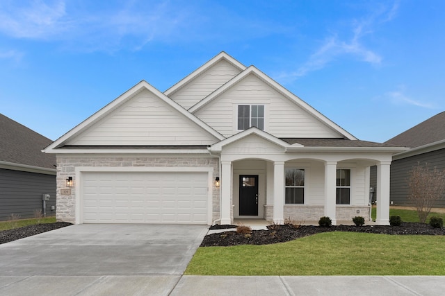 view of front facade with a garage and a front lawn