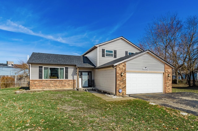 view of front of property featuring a garage, brick siding, driveway, roof with shingles, and a front yard