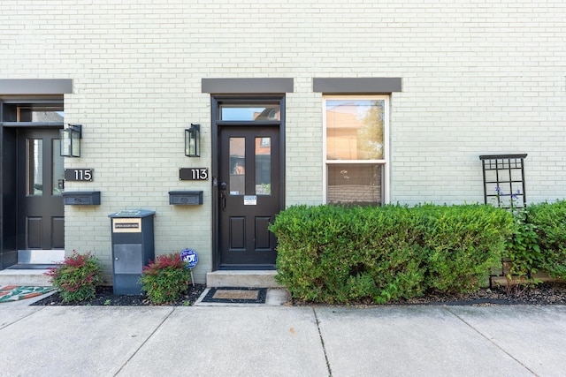 113 E Mithoff St, Columbus, OH 43206 - doorway to property featuring brick siding