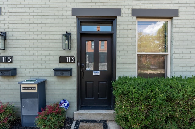 113 E Mithoff St, Columbus, OH 43206 - doorway to property featuring brick siding