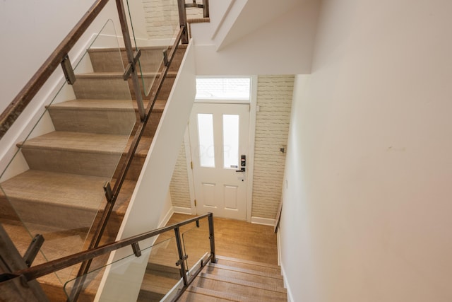 113 E Mithoff St, Columbus, OH 43206 - stairway featuring wood finished floors and a towering ceiling