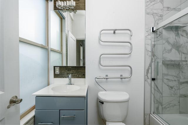 113 E Mithoff St, Columbus, OH 43206 - bathroom featuring vanity, backsplash, and bath / shower combo with glass door