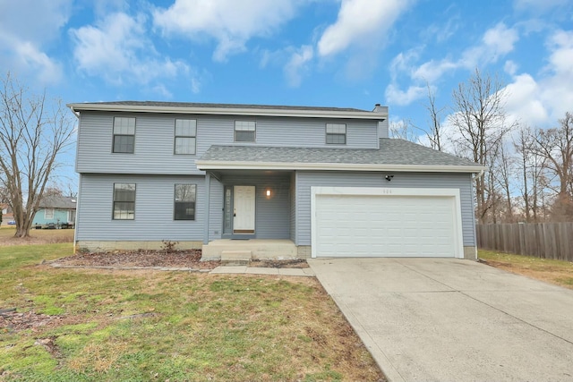 view of front property with a garage and a front yard