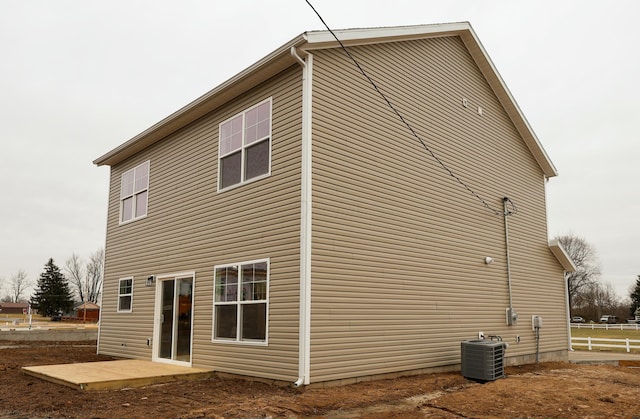 back of house featuring central AC and a patio area