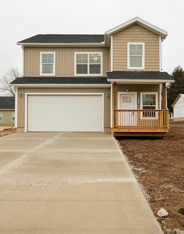 view of front of house with a garage and covered porch