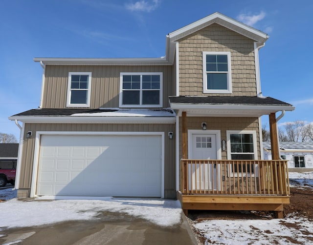 view of front of house featuring covered porch and a garage