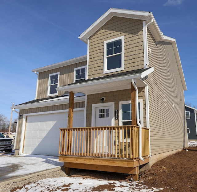 view of front of house featuring a garage and a porch