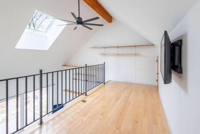 260 King St, Yellow Springs, OH 45387 - additional living space with baseboards, vaulted ceiling with skylight, a ceiling fan, and hardwood / wood-style flooring