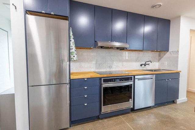 260 King St, Yellow Springs, OH 45387 - kitchen with wooden counters, under cabinet range hood, blue cabinets, and stainless steel appliances