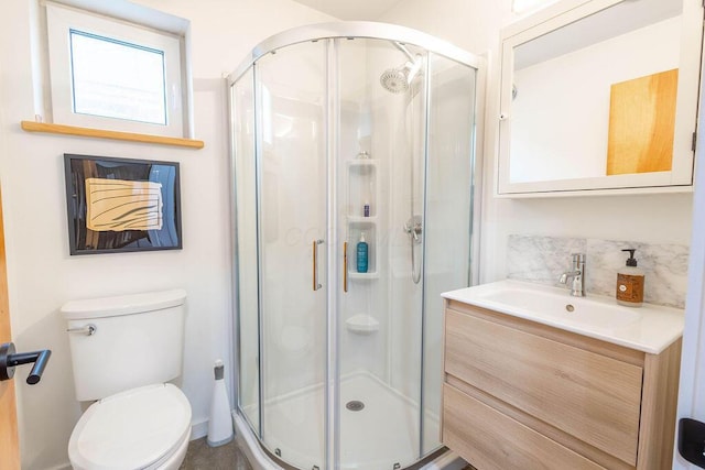260 King St, Yellow Springs, OH 45387 - bathroom featuring a stall shower, toilet, vanity, and backsplash