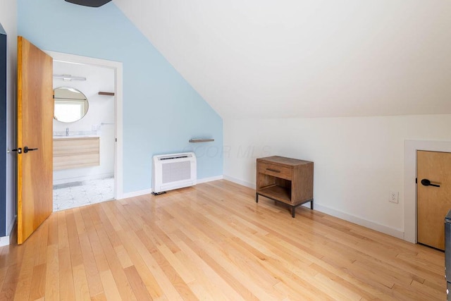 260 King St, Yellow Springs, OH 45387 - bonus room with heating unit, baseboards, vaulted ceiling, and wood finished floors