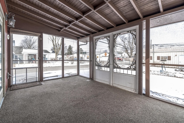 unfurnished sunroom with lofted ceiling