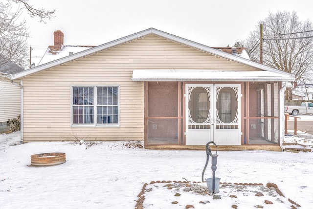 view of front of property featuring a sunroom