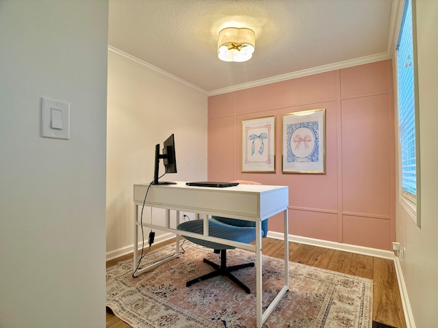 office area featuring crown molding, a textured ceiling, and hardwood / wood-style flooring