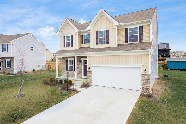 view of front of home with a garage and a front yard